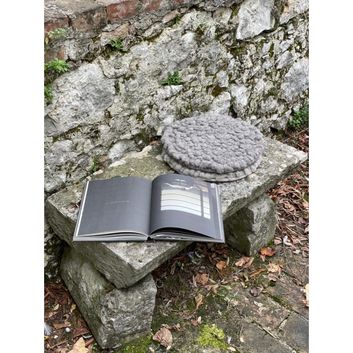 Felt cushion with sheep knots