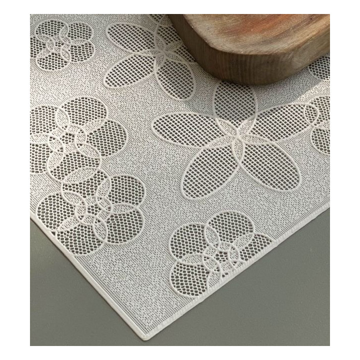 Plastic placemat with drilled flowers